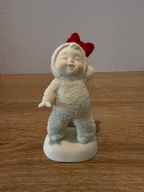 Dept. 56 Snowbabies Star Quality Figurine Snow Baby with Red Bow